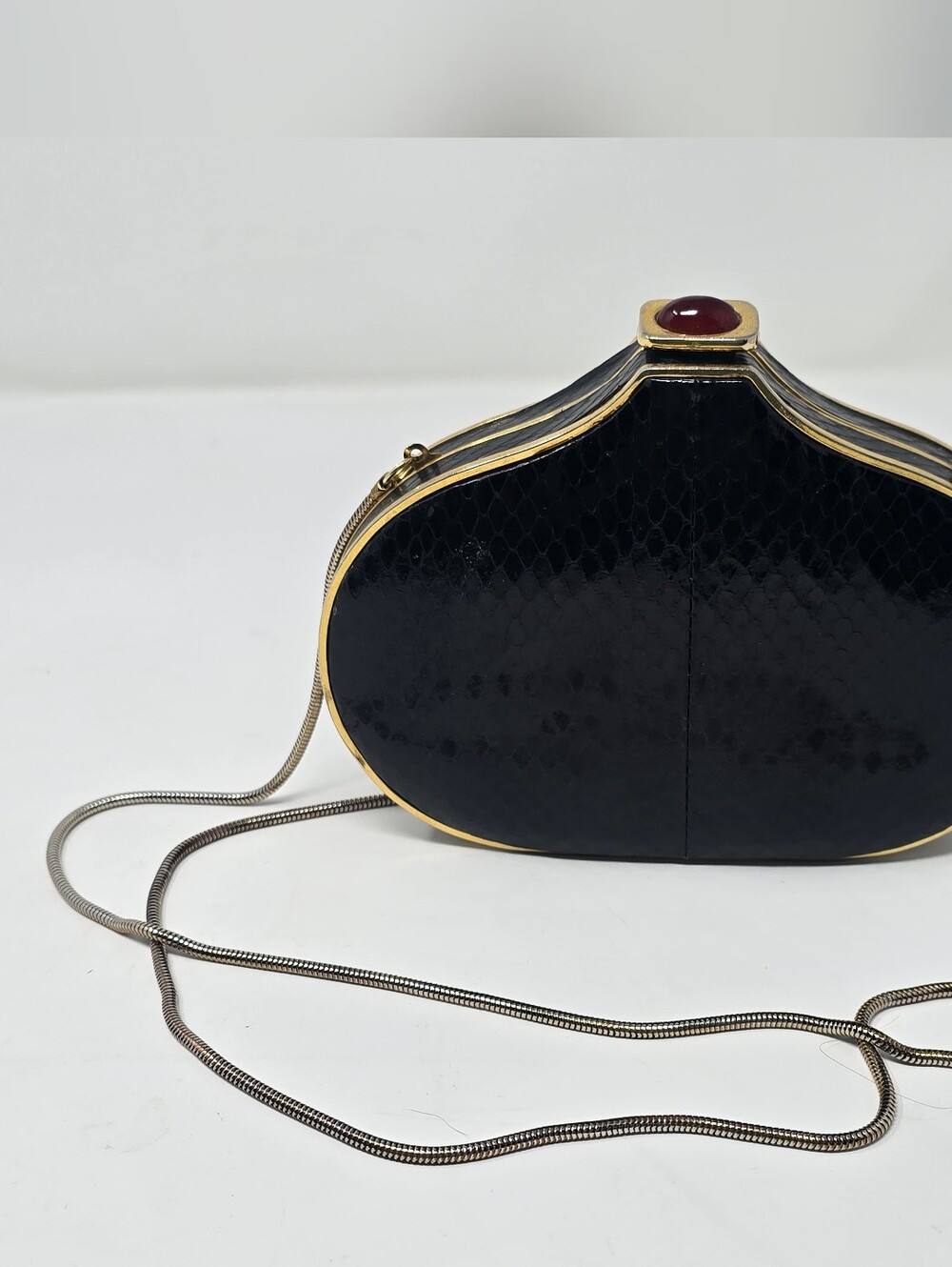 Vintage 1980s Black Faux Snakeskin Hard Shell Clutch Bag with Ruby-Tone Cabochon